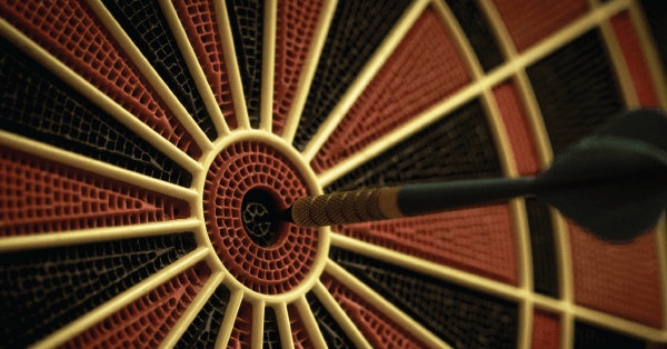 dart board with dart in center